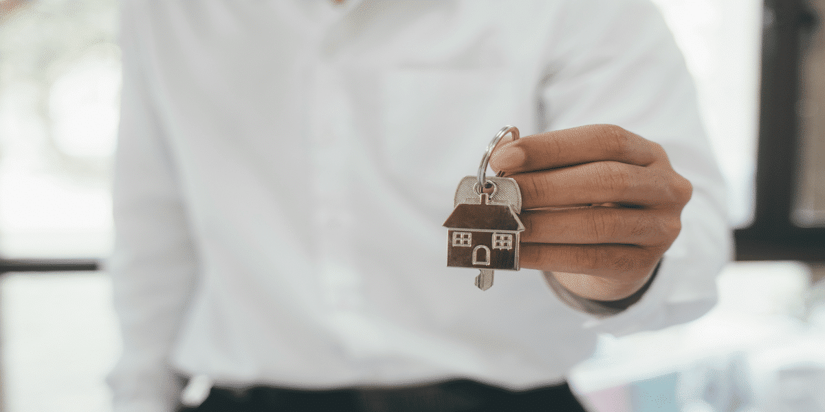 Image commercially licensed from: https://unsplash.com/photos/real-estate-broker-residential-house-rent-listing-contract-offer-of-purchase-house-rental-of-real-estate-giving-offering-demonstration-handing-house-keys-pWZsKeguGyw